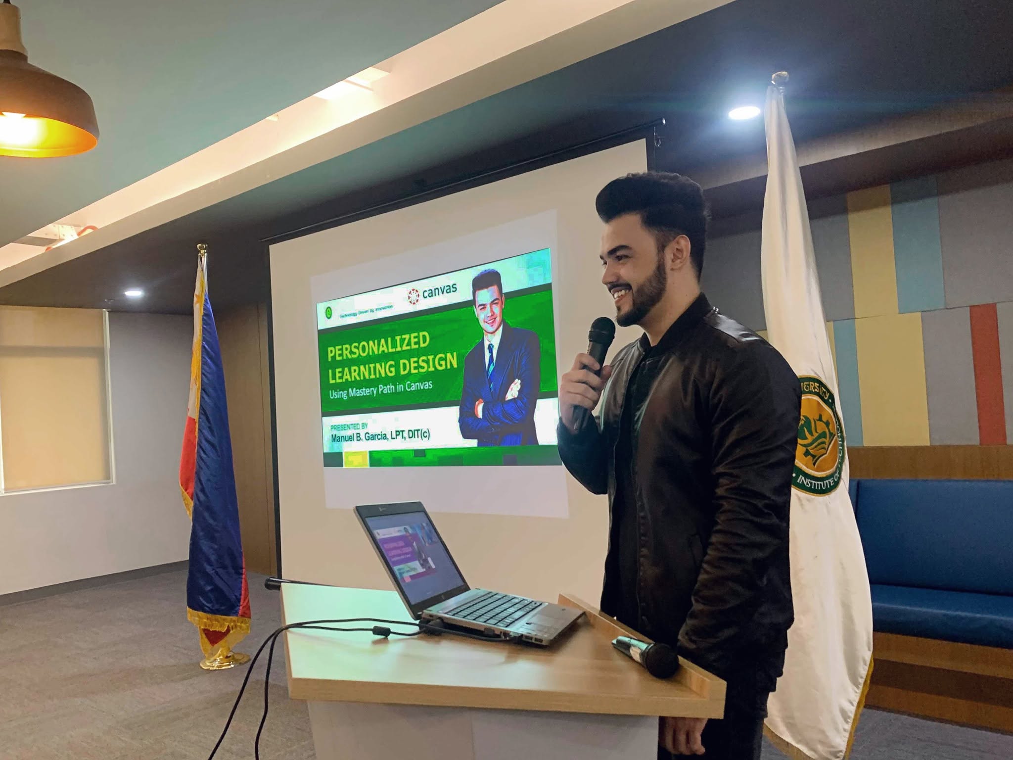 Manuel B. Garcia giving a presentation on personalized learning design at FEU Institute of Technology